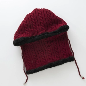 Detail view of burgundy cable knit balaclava with warm faux fur lining and drawstring