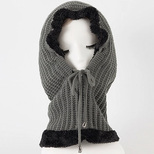 Detail of grey knitted balaclava hood showing soft black faux fur lining and drawstrings