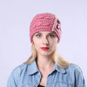 Detail of cable knit headband with vintage brown buttons and delicate lace trim