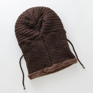 Detail of coffee brown knitted balaclava with warm plush lining and braided cable texture