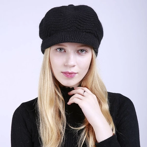 Detail of black knitted beret featuring exquisite wave texture and stylish small brim