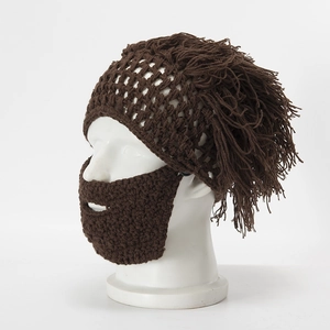 Detailed knit texture of handmade brown wig hat with crochet beard for Halloween party