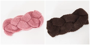 Detailed close-up of chunky knit cable pattern on thick winter headbands in pink and brown