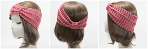 Detail of pink knitted headband featuring thick ribbed texture and a stylish knot design