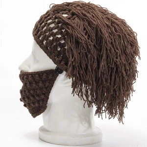 Detail view of brown knit wig hat with long tassels and detachable crochet beard mask