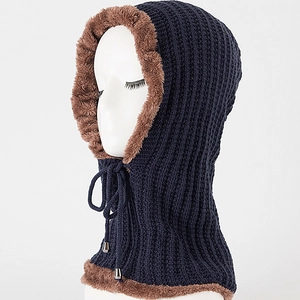 Detail of navy knit hood with warm brown faux fur lining and drawstring adjustment