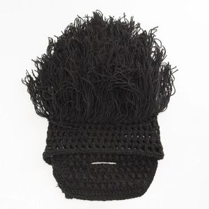 Close-up of black knitted beanie with thick fringe texture for costume party