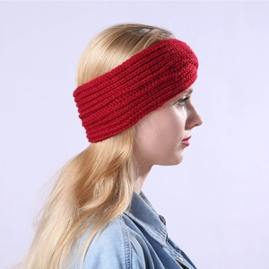 Side view of red knitted headband with striped texture on a model for winter warmth