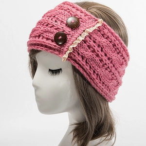 Macro shot of knit ear warmer headband with wood buttons and white lace trim in bright pink