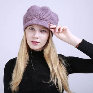 Detail of the purple knit beanie cap showing wavy texture and protective sun visor
