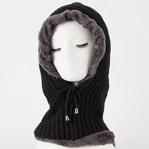 Detail of the thick grey plush lining on a black knitted winter balaclava hood