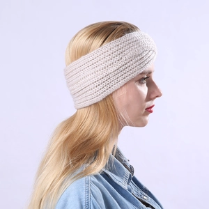 Detail showing hand-knitted cream striped headband with chunky texture on model