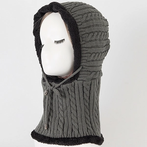 Detail of cable knit winter hood with warm fleece lining and adjustable drawstring