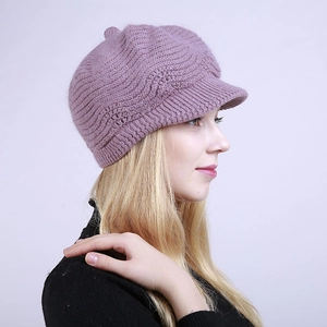 Detail of light purple knitted visor beret featuring a wavy textured weaving pattern