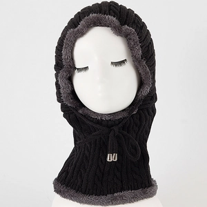 Detail of cable knit balaclava with thick gray faux fur lining and adjustable drawstring