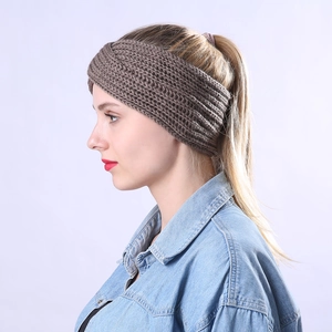Detail view of coffee brown chunky cable knit headband with twisted knot design