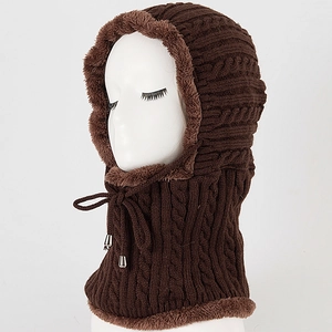 Detail of cable knit winter hood with thick faux fur lining and adjustable drawstring