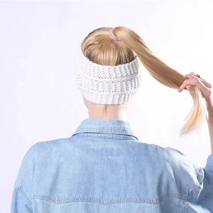 Detail of white knit headband texture with warm ear cover design for ponytails