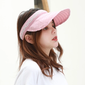 Detail view of pink foldable sun hat showing silver chain pattern and curved brim for women