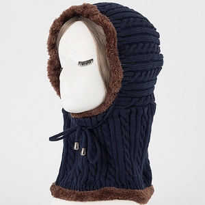 Detail of navy knit balaclava with warm brown plush lining and braided cable texture