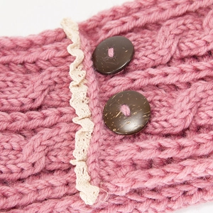 Pink cable knit winter headband with delicate lace trim and vintage wooden buttons