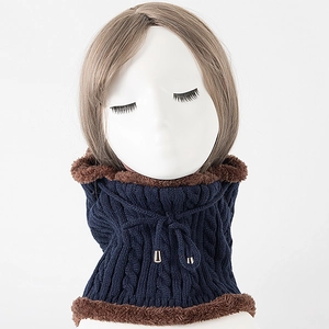 Detail of navy knit neck warmer featuring cable pattern, fleece lining and drawstrings