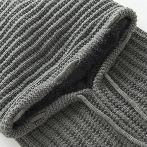 Detailed view of the thick fleece lining and ribbed knit texture of this gray winter hood