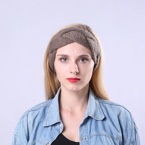 Close-up of thick cable knit texture on brown winter headband for women and men
