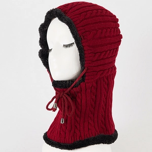 Detail of burgundy cable knit balaclava with thick black fleece lining and drawstring