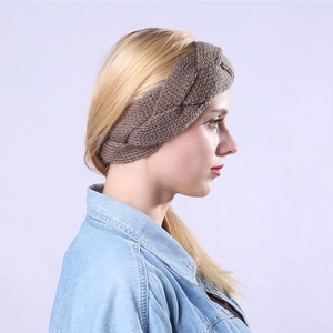 Detailed close-up of brown chunky knit cable pattern on a thermal winter headband
