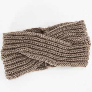 Detailed macro view of dark brown knitted headband with crossed texture and warm yarn
