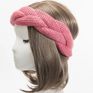 Detail showing pink chunky cable knit texture of the winter warm headband on a model