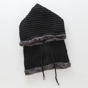 Close-up of knit hood with drawstring, metal tips and grey faux fur lining