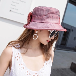 Detail of elegant mesh organza sun hat with mesh flower in wine red and purple