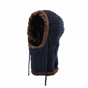 Close-up of cable knit texture with thick brown faux fur lining on a navy balaclava hood