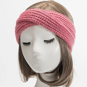 Detailed macro of pink knitted headband texture on mannequin for winter warmth