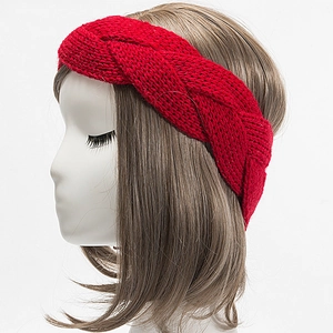 Detail view of red chunky knit headband with twisted design on model prop