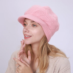 Detailed wave texture on pink knit peaked hat with warm rib knit brim for winter