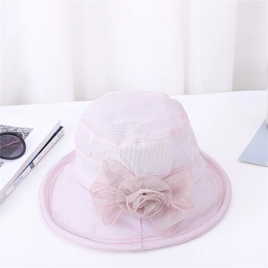 Close-up of the elegant pink organza flower and bow detail on the summer sun hat