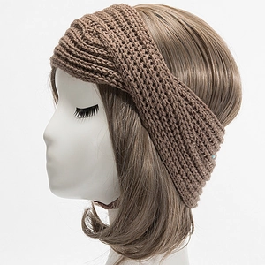 Macro view of brown chunky knit headband texture on white model head display