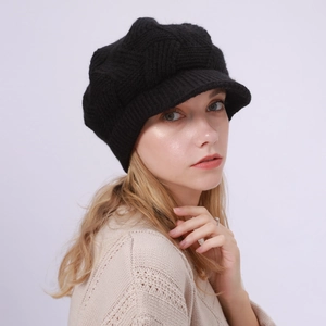 Detail of black twill knit visor beanie showing soft fleece texture and stylish pattern