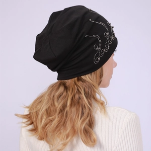 Detail of black cotton slouchy beanie with decorative silver rhinestone wave pattern