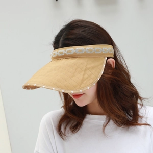 Detail of khaki sun visor with chain pattern and white polka dot edge for summer