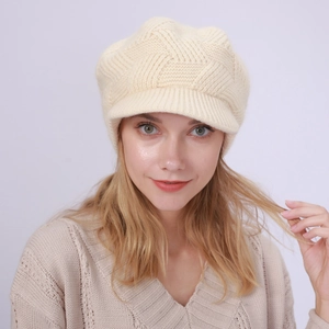 Detailed knit texture of beige thermal visor beanie hat for winter style