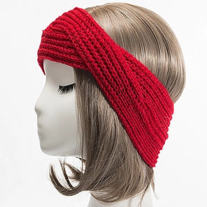 Close-up of red chunky knit headband featuring a stylish front twist and ribbed texture