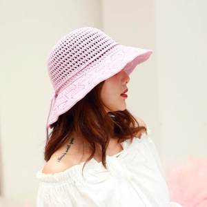 Detailed side view of pink crochet sun hat with breathable knit pattern and bow