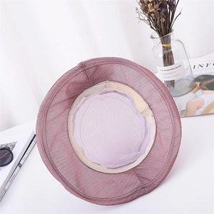 Detail of the inner mesh lining and sweatband inside the purple organza sun hat