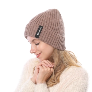 Close-up of brown ribbed knit beanie with Breakout label and warm folded cuff detail