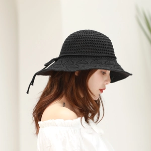 Close-up of black crochet knit sun hat featuring breathable hollow texture and bow detail