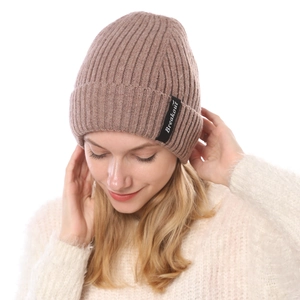 Detail of khaki ribbed knit beanie with Breakout label and warm fleece lining